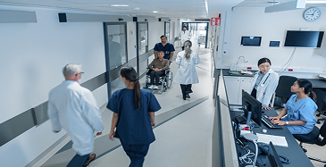 Hospital corridor with staff